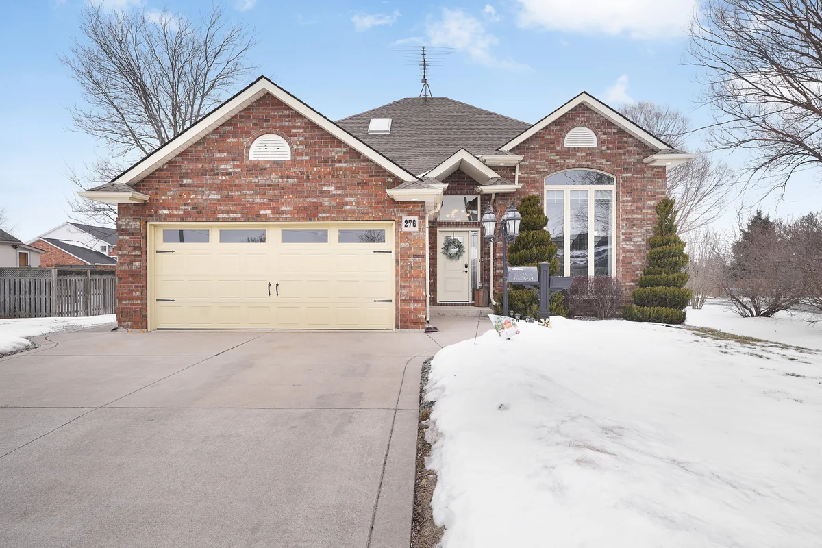 Professional exterior photograph of the brick ranch at 276 Texas Road, Amherstburg